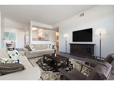 a living room with couches and a table